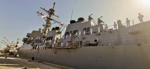 Naval officers stand on a U.S navy vessel as it docks in the eastern city of Port Sudan, Sudan March 1, 2021. REUTERS/El Tayeb Siddiq