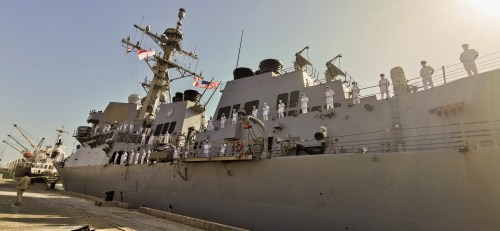 Naval officers stand on a U.S navy vessel as it docks in the eastern city of Port Sudan, Sudan March 1, 2021. REUTERS/El Tayeb Siddiq