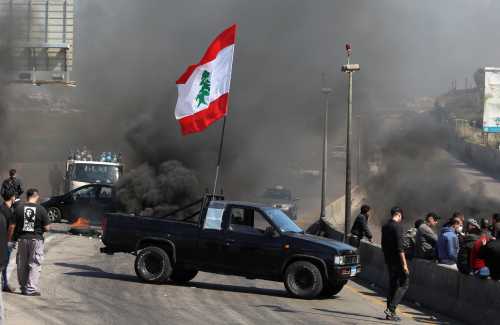 A vehicle blocks a road during a protest against the fall in Lebanese pound currency and mounting economic hardships in Khaldeh, Lebanon March 8, 2021. REUTERS/Mohamed Azakir