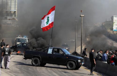 A vehicle blocks a road during a protest against the fall in Lebanese pound currency and mounting economic hardships in Khaldeh, Lebanon March 8, 2021. REUTERS/Mohamed Azakir