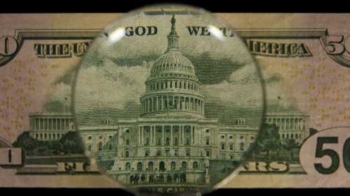 Close up of the capitol building on a fifty dollar bill.
