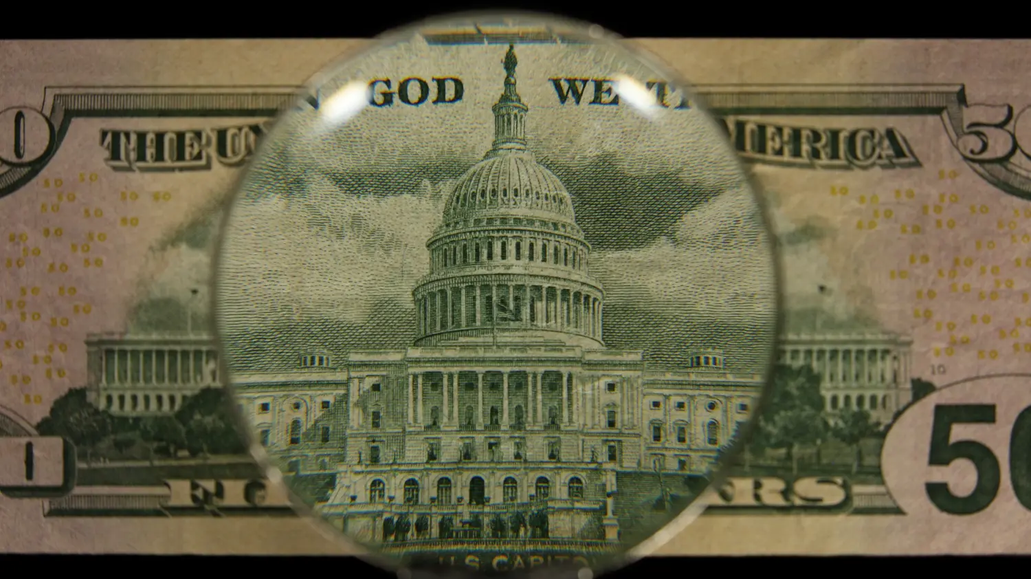 Close up of the capitol building on a fifty dollar bill.