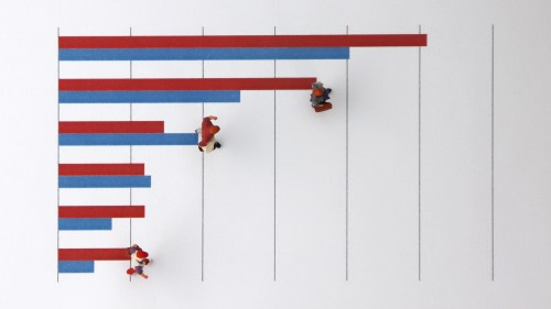 Miniatures of people walking on a bar graph.