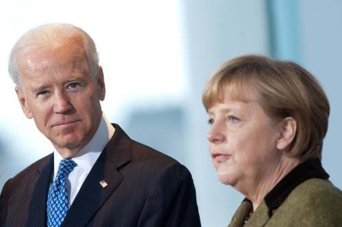 Chancellor Angela Merkel (R) receives the then US Vice President Joe Biden in the Chancellor's Office. US President Joe Biden alongside German Chancellor Angela Merkel will participate in a G7 video conference and the Munich Security Conference on Friday, in his first appearances at international summits since his inauguration last month.