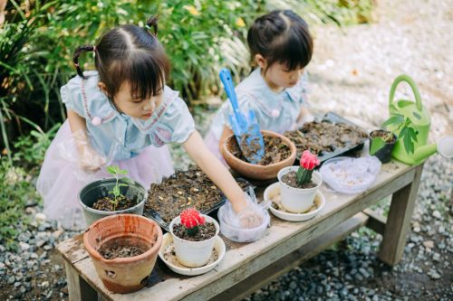 Two students learn how to garden.