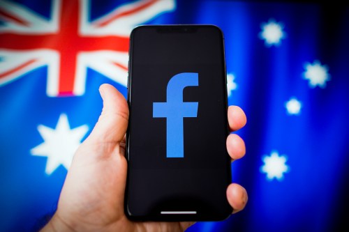 The Facebook logo is seen with the Australian flag in the background in this photo illustration in Warsaw, Poland on February 20, 2021. In retalition for the Australian government demand Facebook pay for news linked to from other websites Facebook has blocked news feeds from it's platform and inadvertently also blocked emergency services. (Photo by Jaap Arriens / Sipa USA)No Use Germany.