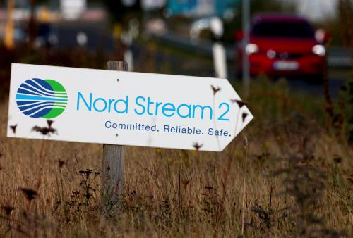 FILE PHOTO: A road sign directs traffic towards the Nord Stream 2 gas line landfall facility entrance in Lubmin, Germany, September 10, 2020.   REUTERS/Hannibal Hanschke/File Photo