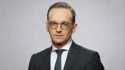 A man in a dark suit.