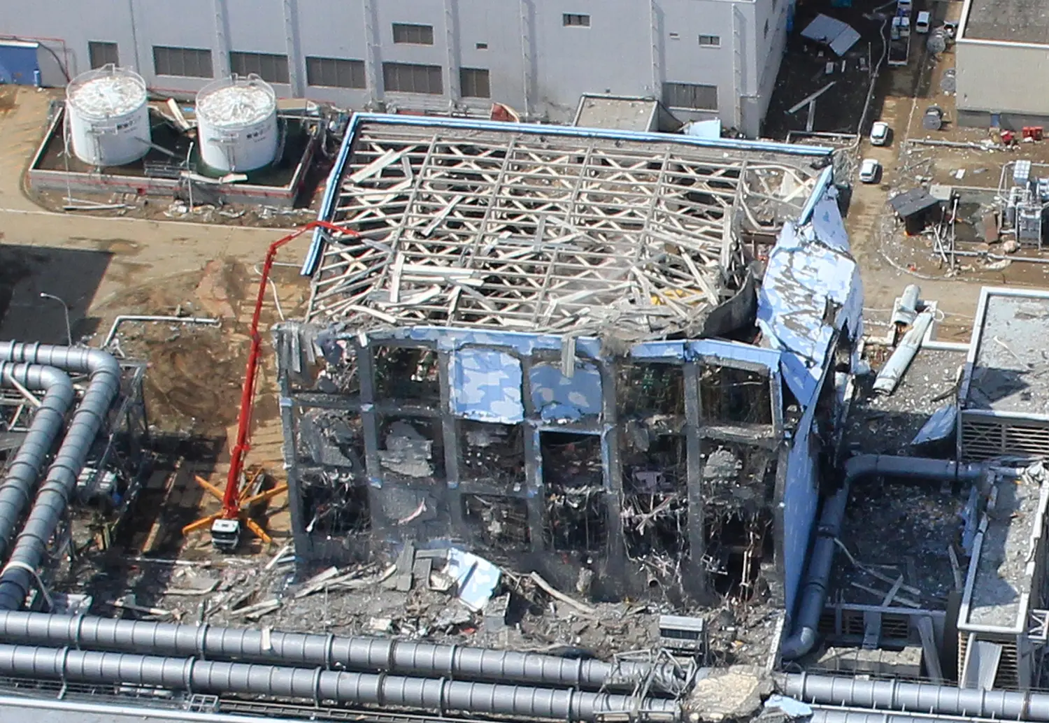 FILE PHOTO: An aerial view of the Fukushima Daiichi Nuclear Power Station is seen in Fukushima Prefecture in this photo taken by the Air Photo Service on March 24, 2011. Mandatory Credit Air Photo Service/Handout via REUTERS/File Photo ATTENTION EDITORS - MANDATORY CREDIT.  THIS IMAGE HAS BEEN SUPPLIED BY A THIRD PARTY. SEARCH "10TH ANNIVERSARY OF JAPAN'S QUAKE, TSUNAMI AND NUCLEAR DISASTER" FOR THE PHOTOS.