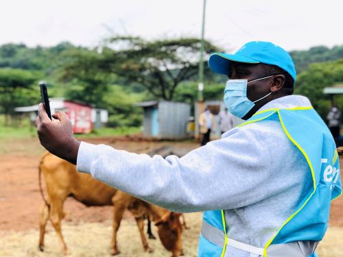 Telkom Kenya CEO Mugo Kibati uses his cell phone to test the Loon technology internet via video call as Alphabet Inc begins offering the world's first commercial high-speed internet using balloons to villagers in Radad, Baringo County, Kenya July 8, 2020. REUTERS/Jackson Njehia