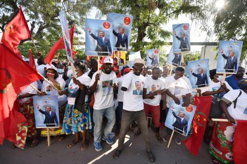 Supporters of President Denis Sassou Nguesso celebrate after the election commission announced his re-election In Brazzaville, Republic of Congo, March 23, 2021. REUTERS/ Olivia Acland