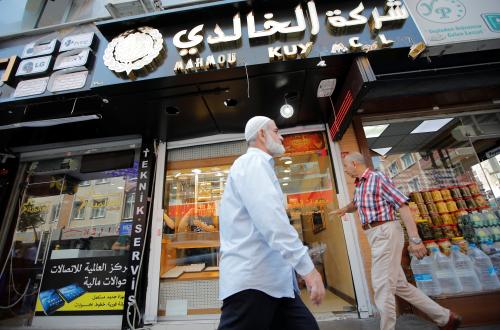 People walk past by a Syrian jewelry shop in Istanbul's Kucukcekmece district, Turkey, July 5, 2019. Picture taken July 5, 2019. REUTERS/Kemal Aslan