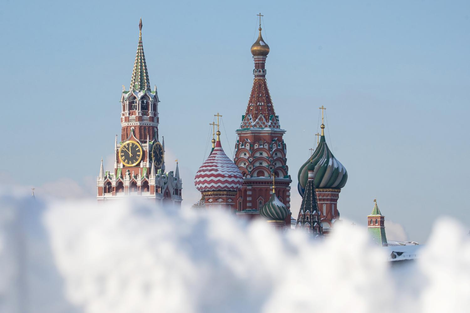 MOSCOW, RUSSIA  FEBRUARY 18, 2021: Piles of snow are seen in Vasilyevsky Spusk Street off Red Square. Seen in the distance is Spasskaya Tower of the Moscow Kremlin and St Basil's Cathedral. On 18 February, daytime temperatures in Moscow varied between -19 and -13 degrees Celsius. Between 12  and 14 February, Moscow received nearly 85% of a months worth of precipitation. Stanislav Krasilnikov/TASS.No use Russia.