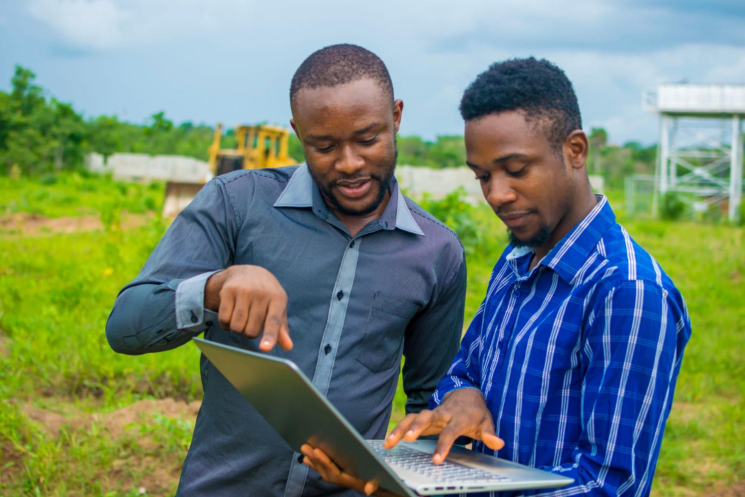 Two men working on a computer