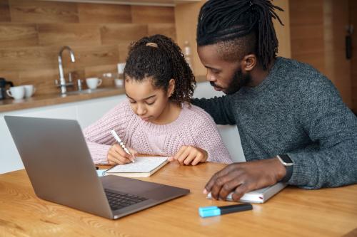 Man helping child with homework