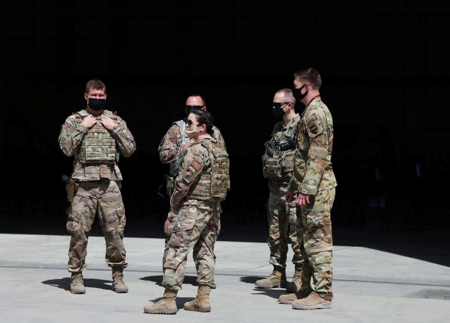 U.S. troops stand guard during a handover ceremony of A-29 Super Tucano planes from U.S. to the Afghan forces, in Kabul, Afghanistan September 17, 2020. REUTERS/Omar Sobhani