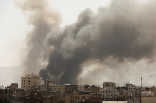 FILE PHOTO: Smoke billows from the site of Saudi-led air strikes in Sanaa, Yemen March 7, 2021. REUTERS/Khaled Abdullah/File Photo