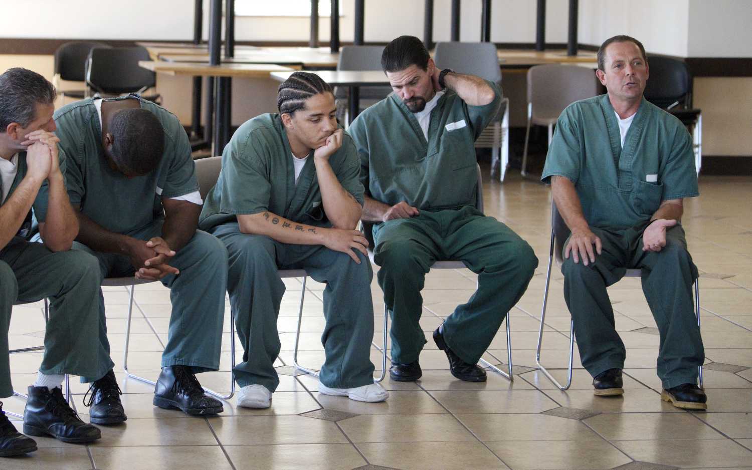 Arrowhead prison convict Robert G. (R) makes his case why he should be accepted into Peer 1 at a meeting with Peer 1 staff at the prison in Canon City, Colorado September 24, 2014. With him are (L to R) Raymond A., who was accepted into Peer 1; an unidentified man with head down; â€œLuckyâ€?, who is still in prison; Steve P. who was accepted into Peer 1. Robert G. has 11 felony convictions for drug-related crimes and has been in and out of prison or rehab over the last 25 years. Robert G. was accepted into Peer 1. Peer 1 is a drug and alcohol rehabilitation programme for men, many having spent years in and out of prison, in Denver, Colorado. The men have often tried and failed over and over to turn their life around. With histories of abuse as children and living on the streets, they come to Peer 1 hoping to turn away from addiction and crime, to rebuild their lives and learn how to integrate into society. Treatment includes family group therapy, meditation and trust-building exercises. REUTERS/Rick WilkingPICTURE 1 OF 26 FOR WIDER IMAGE STORY "PEER 1: PRISON, DEATH OR RECOVERY". SEARCH "PEER WILKING" FOR ALL IMAGES