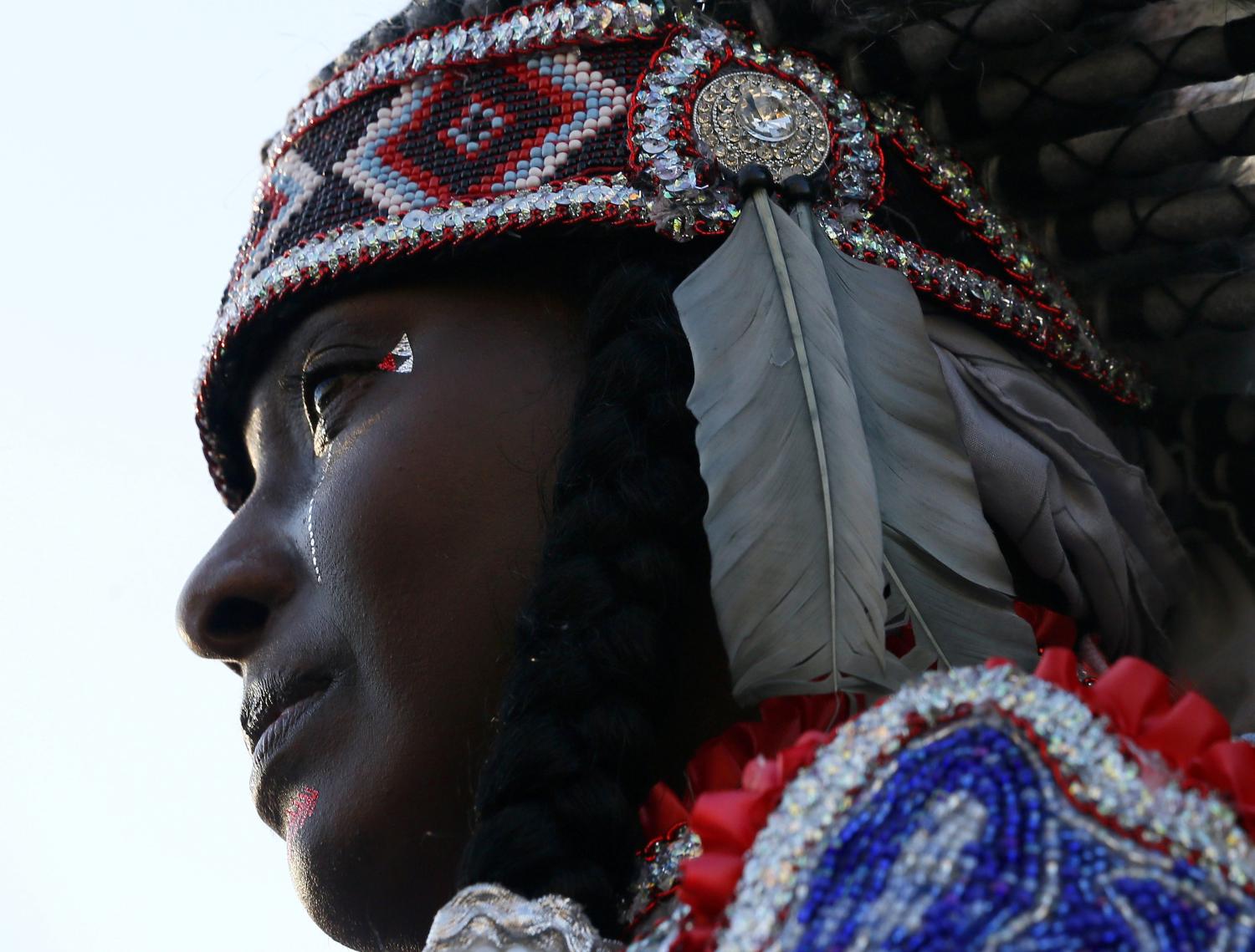 Tonya Johnson, Big Queen of the Wild Tchoupitoulas Indian Tribe, who went to high school with Baton Rouge police officer Montrell Jackson, who was shot and killed Sunday morning, attends a vigil in Baton Rouge, Louisiana, U.S. July 19, 2016.  REUTERS/Jonathan Bachman