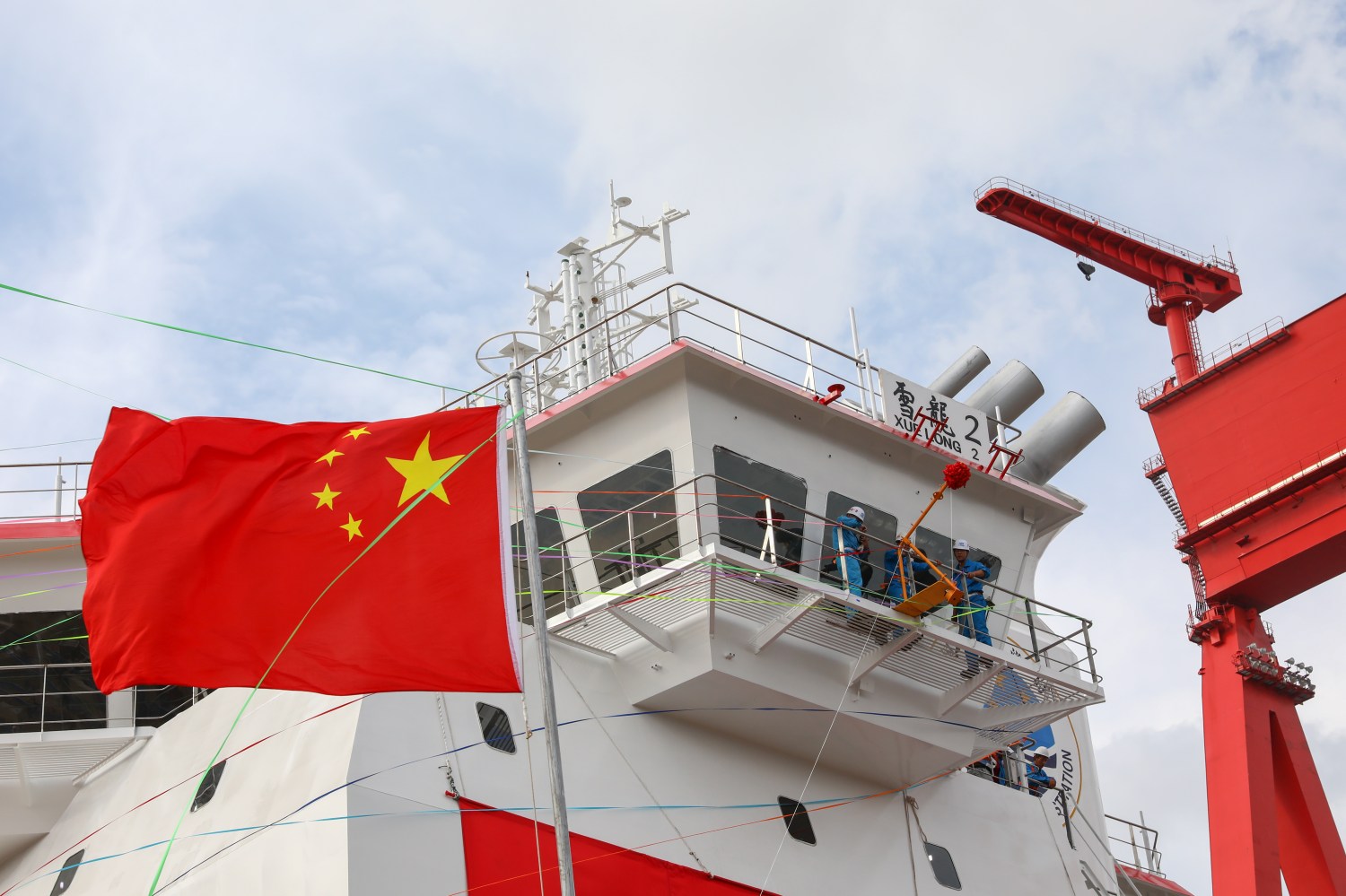 China's first domestically-built polar research vessel and icebreaker "Xuelong 2" prepares to take water at Jiangnan Shipyard in Chongming's Changxing Island in Shanghai, China, 10 September 2018.China's first wholly domestically conceived and built icebreaker Xuelong 2 took to the sea on Monday (10 September 2018) at Jiangnan Shipyard in Chongming's Changxing Island. Construction of the vessel began in December 20, 2016. Xuelong 2 will be put into service in the first half of 2019. It will team up with another icebreaker Xuelong on polar expeditions next year. The vessel is 122.5 meters in length and 22.3 meters wide, with a draught of 7.85 meters and displacement of 13,990 tons. It can reach 15 knots and it has a range of 20,000 nautical miles. Xuelong 2 can break 1.5-meter ice with a thick covering of snow at speeds of 2 to 3 knots. Its combines the requirements of a new-generation research vessel with environmental protection having an azimuthing electric propulsion system. Researchers can make observations of environmental elements like the ocean water, sea ice and polar air from the vessel and take samples from the marine environment in connection with climate change.No Use China. No Use France.
