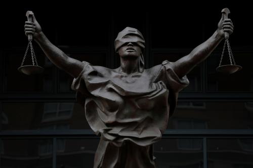 A bronze statue titled "Justice Delayed, Justice Denied" depicting a figure of Justice is seen on the Albert V. Bryan United States Courthouse in Alexandria, Virginia, U.S., September 1, 2020. REUTERS/Andrew Kelly