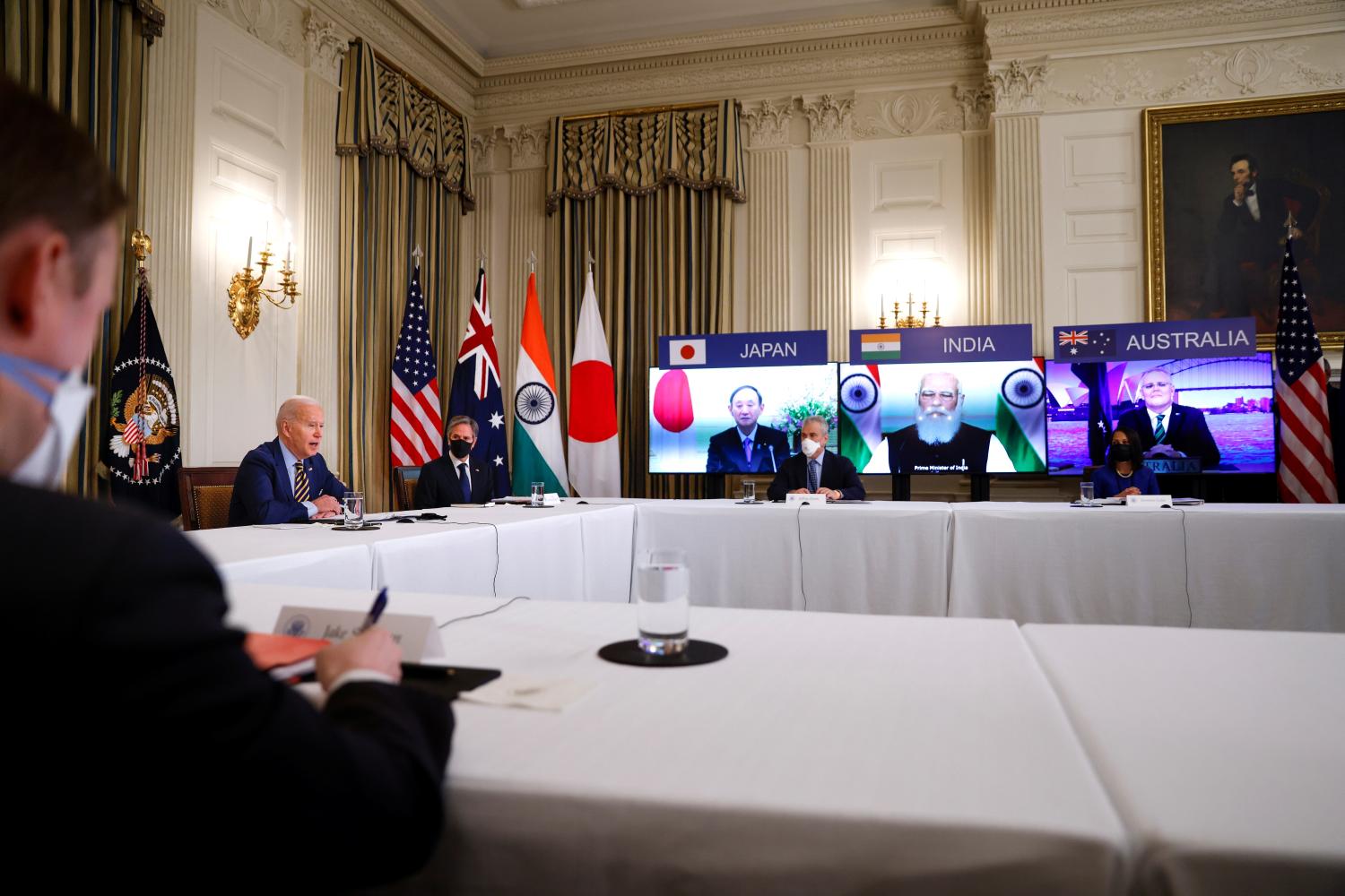 U.S. President Joe Biden and Vice President Kamala Harris, not pictured, participate beside staff and cabinet members in a virtual meeting with Asia-Pacific nation leaders at the White House in Washington, U.S., March 12, 2021. REUTERS/Tom Brenner