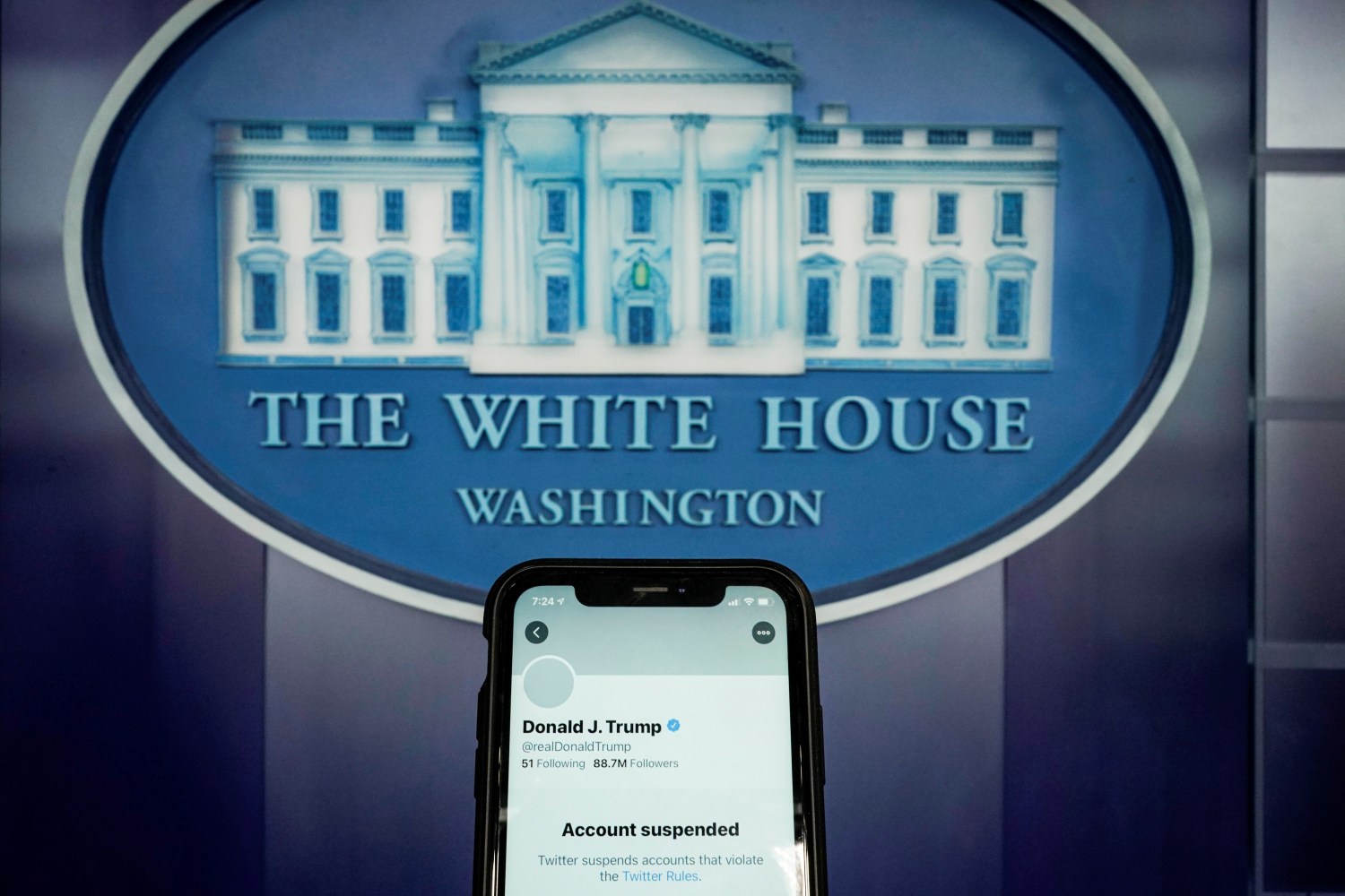 FILE PHOTO: A photo illustration shows the suspended Twitter account of former U.S. President Donald Trump on a smartphone at the White House briefing room in Washington, U.S., January 8, 2021.  REUTERS/Joshua Roberts/Illustration/File Photo