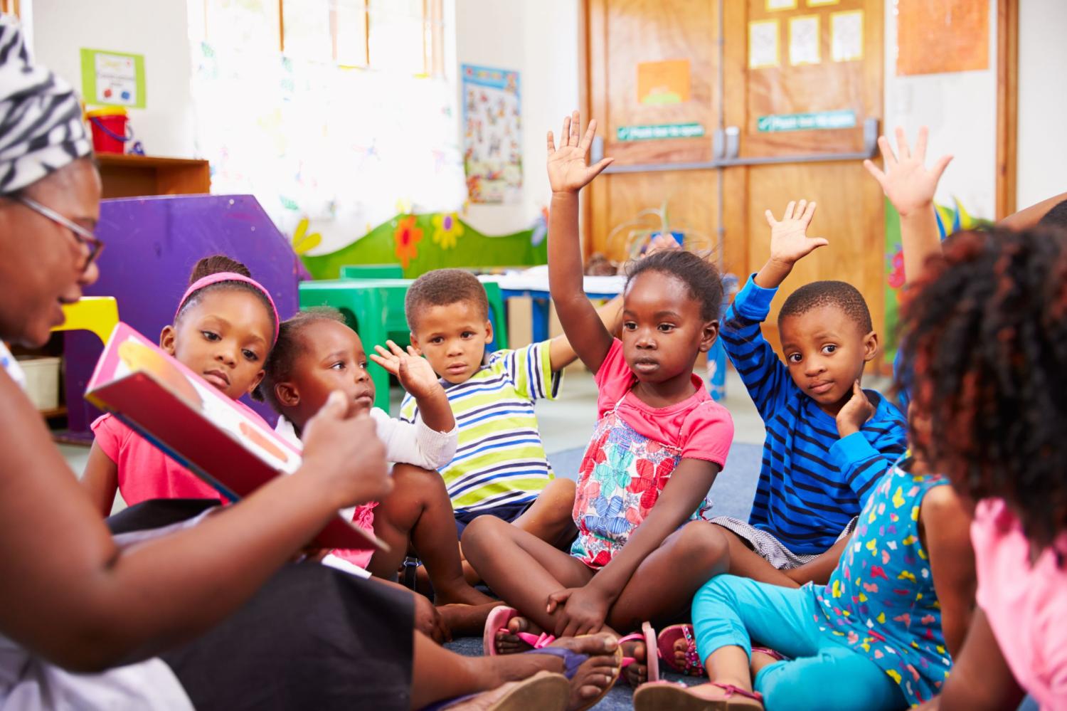 Children in Tanzania read a book.