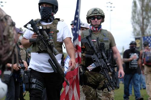 Proud Boys carry assault rifles as they gather in Portland, Ore., at Delta Park on September 26, 2020, in support of Kenosha shooter Kyle Rittenhouse and Aaron 'Jay' Danielson who was shot dead by an antifascist protester during the ongoing Black Lives Matter protests in the city. (Photo by Alex Milan Tracy/Sipa USA)No Use UK. No Use Germany.