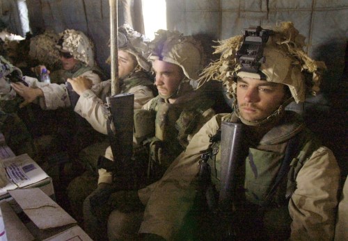 FILE PHOTO: Marine reinforcements fly towards an area somewhere near Kandahar, Afghanistan, December 10, 2001.  Earnie Grafton, The San Diego Union-Tribune/Pool via REUTERS/File Photo