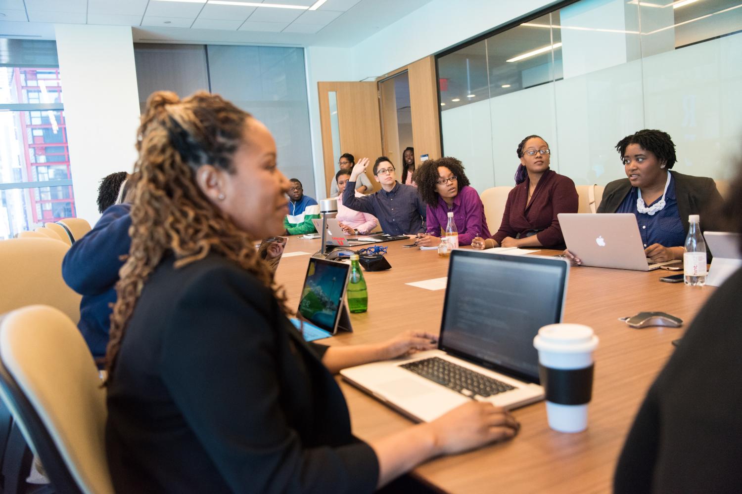 Staff meeting at a small business startup. (Photo courtesy wocintechchat.com)