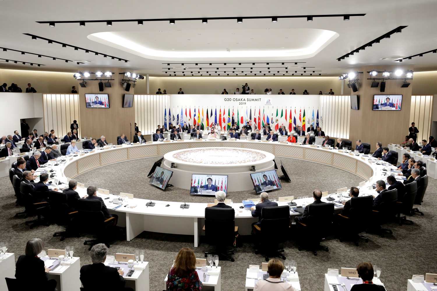 Japan's Prime Minister Shinzo Abe speaks while other leaders listen during a working lunch at the Group of 20 (G-20) summit in Osaka, Japan, on Friday, June 28, 2019. Kiyoshi Ota/Pool via REUTERS