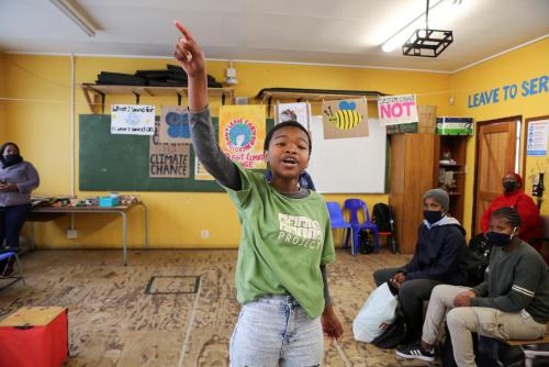 A girl gestures as she takes part in a demonstration as part of a global day of action on climate change at the school in Khayelitsha township near Cape Town, South Africa, September 25, 2020. REUTERS/Sumaya Hisham