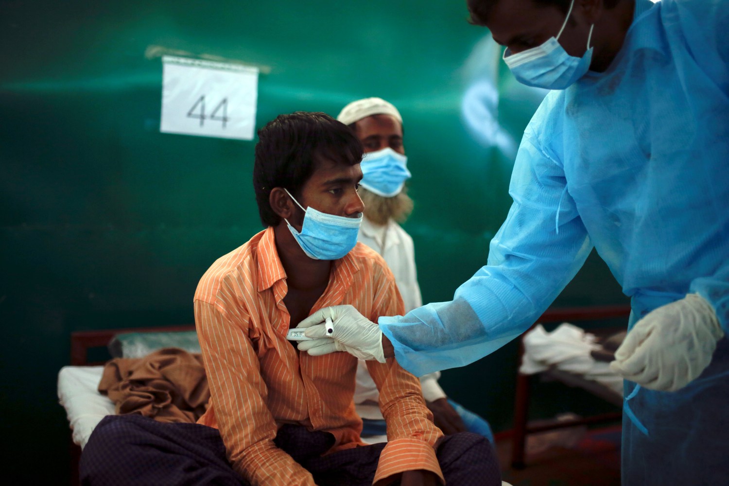 Rohingya refugee Nur Islam, 24, who suffers from diphtheria, is examined by a doctor at a Medecins Sans Frontieres (MSF) clinic near Cox's Bazar, Bangladesh December 18, 2017. According to the World Health Organisation (WHO) from November 3 through December 12, a total of 804 suspected diphtheria cases including 15 deaths were reported among the displaced Rohingya population in Cox's Bazar. REUTERS/Alkis Konstantinidis