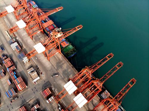 Photo shows local workers are busy loading and unloading of import and export cargo at Lianyungang port container terminal in Lianyungang City, east China's Jiangsu Province, 8 March 2021.No Use China. No Use France.