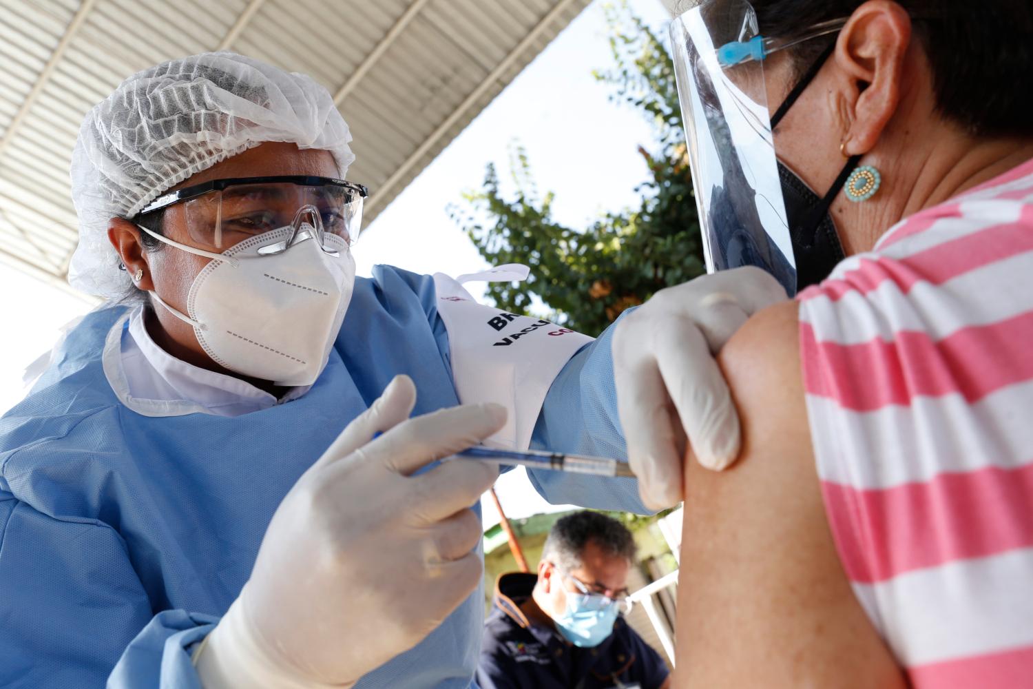 A person receives a dose of Pfizer-BioNTech Covid-19 vaccine, during mass vaccine inside of Hermanos Lopez Rayon sports center, a designated  priority vaccination center for elderly over 60 years in the Uruapan town. On March 10, 2021 in Michoacan, Mexico (Photo by Eyepix/Sipa USA)No Use Germany.