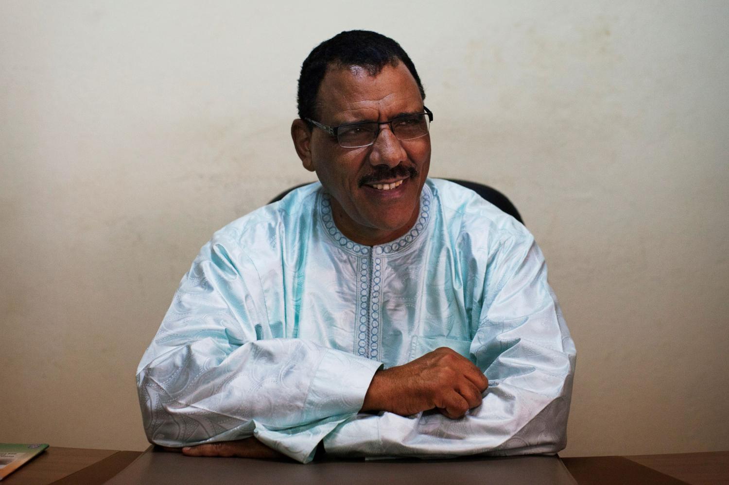 FILE PHOTO: Mohamed Bazoum sits at his pollitical party headquarters in Niamey, September 14, 2013.  The ruling party's candidate, Bazoum, will enter Sunday's presidential run-off vote as the favourite to succeed outgoing Mahamadou Issoufou    REUTERS/Joe Penney/File Photo