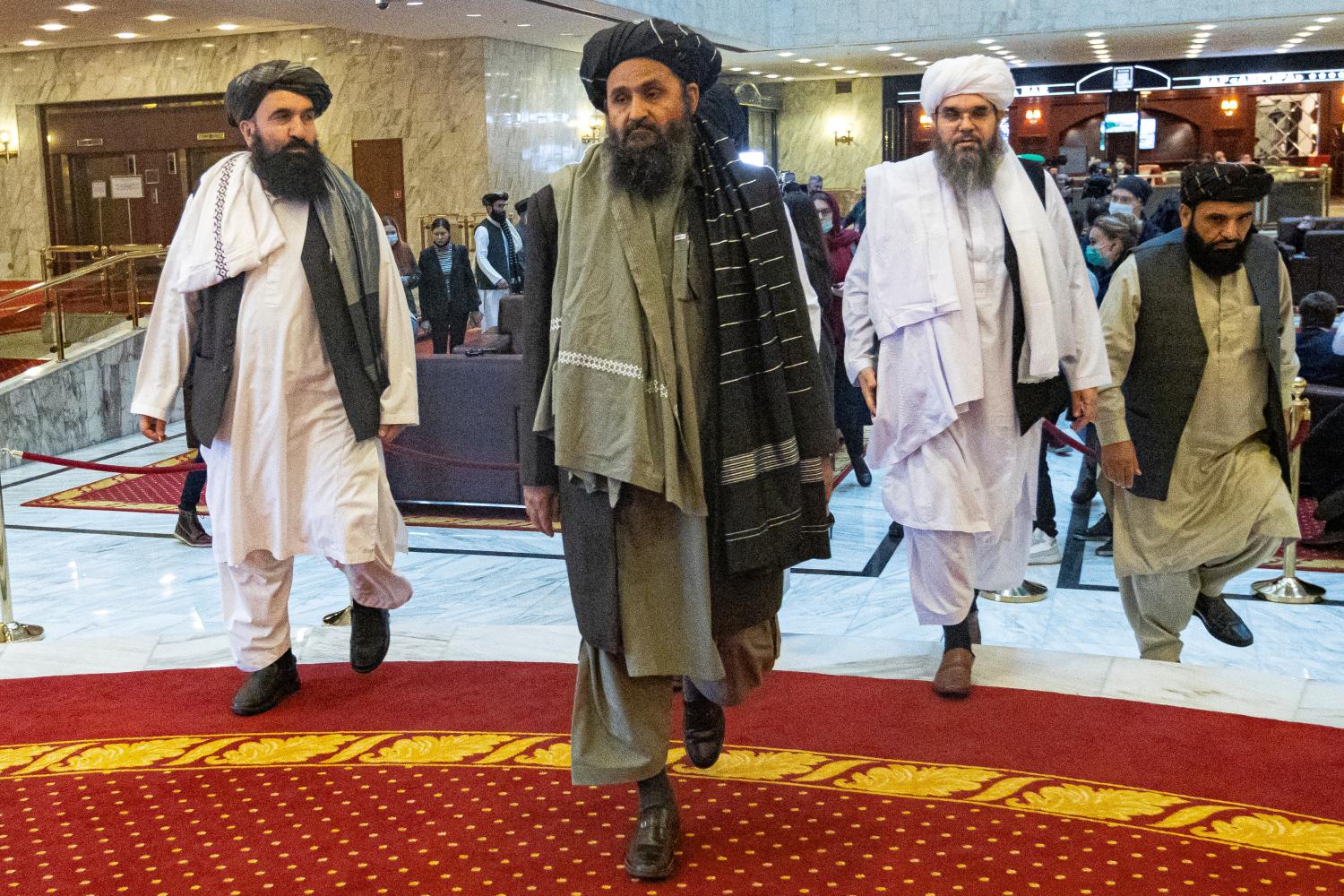 Mullah Abdul Ghani Baradar, the Taliban's deputy leader and negotiator, and other delegation members attend the Afghan peace conference in Moscow, Russia March 18, 2021. Alexander Zemlianichenko/Pool via REUTERS