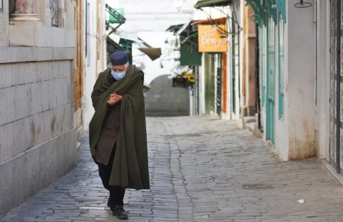 January 14, 2021 - Tunis, Tunisia: The old town of Tunis is almost empty on the 10th anniversary of the Jasmin revolution after the Tunisian government declared a four-day Covid lockdown, banning all demonstrations and closing most non-essential shops. Tunisia was bracing for the 10th anniversary of the 2011 revolution, which kicked off the Arab Spring. The mood acrossTunisia is gloomy as the transition to a democratic system didn't help lifting the country out of poverty.Atmosphere de rue a Tunis, le jour du 10eme anniversaire de la revolution du Jasmin. Le gouvernement tunisien a ordonne un confinement general de quatre jours coincidant avec le 14 janvier 2021. Toutes les manifestations sont interdites, et les boutiques sont fermees et la medina est quasiment vide.NO USE FRANCE