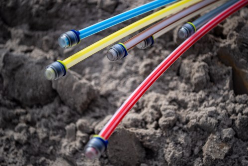 Fiber optic cables lie on a construction site. The infrastructure project is intended to supply 2900 households and business locations in the southwest of the city of Leer with fast Internet.
