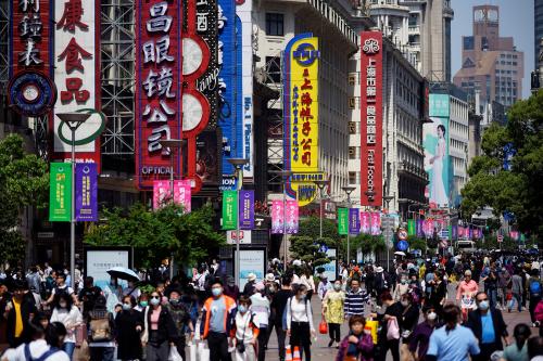 People walk along Nanjing Pedestrian Road, a main shopping area, during the Labour Day holiday, following the outbreak of the coronavirus disease (COVID-19), in Shanghai, China May 5, 2021. REUTERS/Aly Song