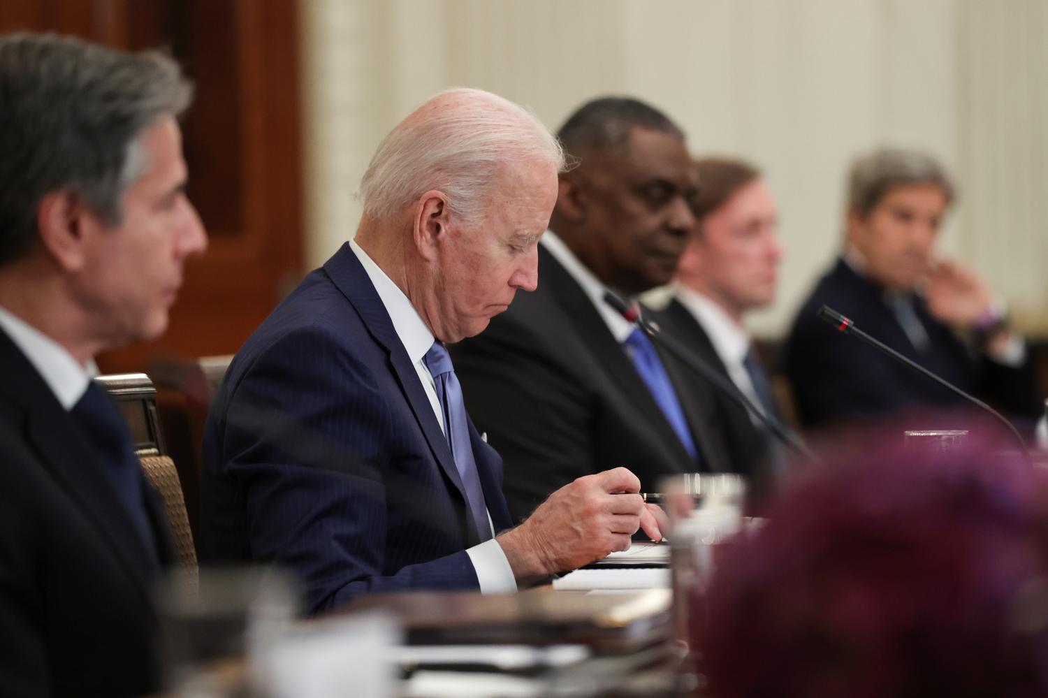 U.S. President Joe Biden, U.S. climate envoy John Kerry, U.S. National Security Advisor Jake Sullivan and U.S. Defense Secretary Lloyd Austin participate in an expanded bilateral meeting with South Korea's President Moon Jae-in (not pictured) at the White House, in Washington, U.S. May 21, 2021.  REUTERS/Jonathan Ernst