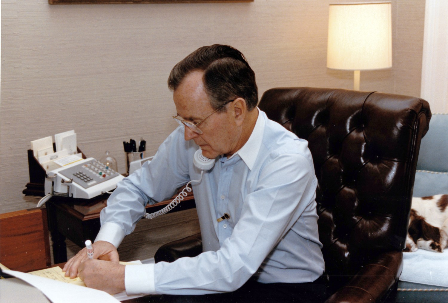 United States President George H.W. Bush speaks by telephone to US Secretary of State James A. Baker, III after the Secretary's first meeting with Foreign Minister Tariq Aziz of Iraq at the White House in Washington, DC on January 9, 1991. Photo by Carol T. Powers / White House via CNP/ABACAPRESS.COM