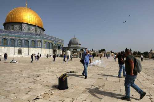 Palestinians react during clashes with Israeli police at the compound that houses Al-Aqsa Mosque, known to Muslims as Noble Sanctuary and to Jews as Temple Mount, in Jerusalem's Old City, May 10, 2021. REUTERS/Ammar Awad