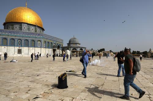 Palestinians react during clashes with Israeli police at the compound that houses Al-Aqsa Mosque, known to Muslims as Noble Sanctuary and to Jews as Temple Mount, in Jerusalem's Old City, May 10, 2021. REUTERS/Ammar Awad