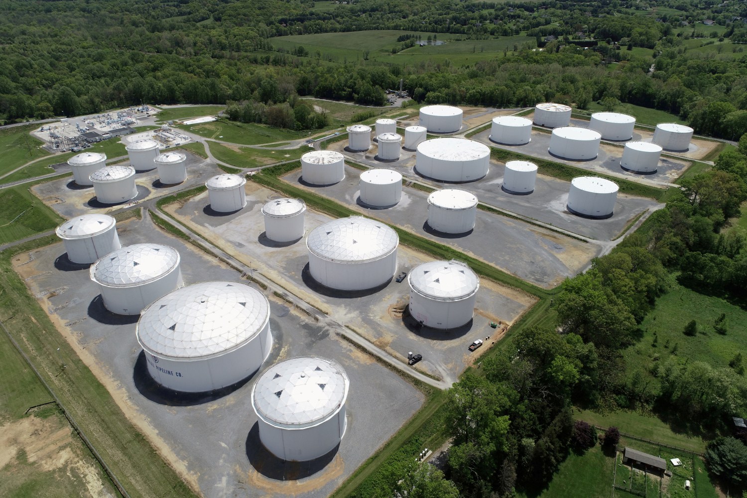 FILE PHOTO: Holding tanks are seen in an aerial photograph at Colonial Pipeline's Dorsey Junction Station in Woodbine, Maryland, U.S. May 10, 2021. REUTERS/Drone Base/File Photo/File Photo