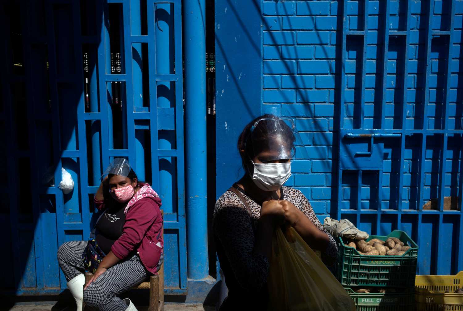 Hellen Nanez, who lost 13 relatives to the coronavirus disease (COVID-19) and whose father is being treated for COVID-19 in the Intensive Care Unit, shops ingredients to make handmade soap for sale, in Pisco, Peru, May 8, 2021. Picture taken May 8, 2021. REUTERS/Alessandro Cinque