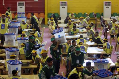 Workers from Iraqi Independent High Electoral Commission (IHEC) count votes at an analysis centre in Kerbala, south of Baghdad May 2, 2014. Iraq held a democratic vote to choose a leader with no foreign troops present for the first time on Wednesday, as Shi'ite Prime Minister Nuri al-Maliki sought to hold power for a third term in a country again consumed by sectarian bloodshed. The electoral commission said 60 percent of all voters had so far cast a ballot, according to initial data - but returns were not yet in from some areas. Counting may take three weeks. The commission hopes to declare final results by the end of May. REUTERS/Mushtaq Muhammed (IRAQ - Tags: POLITICS ELECTIONS)