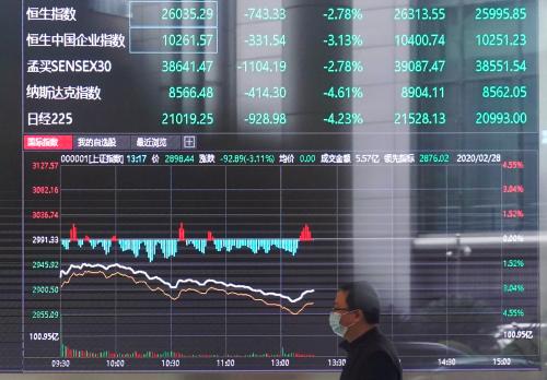 A man wearing a face mask is seen inside the Shanghai Stock Exchange building, as the country is hit by a novel coronavirus outbreak, at the Pudong financial district in Shanghai, China February 28, 2020.  REUTERS/Aly Song