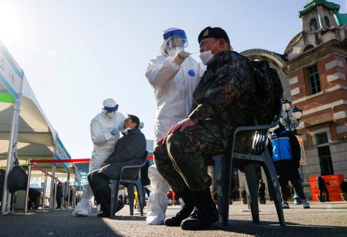 A South Korean soldier undergoes a coronavirus disease (COVID-19) test at a coronavirus testing site which is temporarily set up at a railway station in Seoul, South Korea, December 15, 2020. REUTERS/Kim Hong-Ji TPX IMAGES OF THE DAY